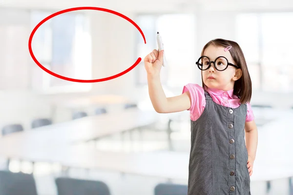 Cute little girl wearing business dress and writing on glass board or working with virtual screen 3. Office background. — Stock Photo, Image