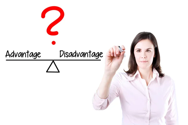 Young business woman writing advantage and disadvantage compare on balance bar. — Stock Photo, Image