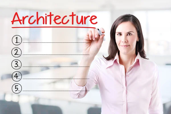 Business woman writing blank Architecture list. Office background. — Stock Photo, Image