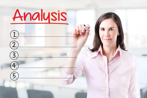 Business woman writing blank Analysis list. Office background. — Stock Photo, Image