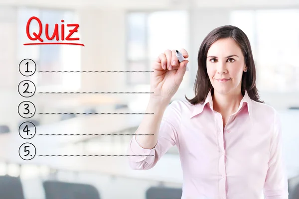 Business woman writing blank Quiz list. Office background. — Stock Photo, Image