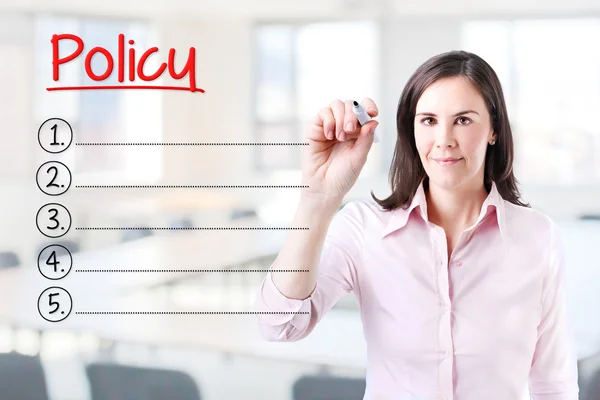 Business woman writing blank Policy list. Office background. — Stock Photo, Image