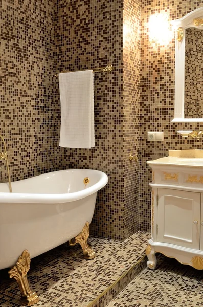 Interior of a bathroom in retro style - bath, mirror and cupboard with washbasin — Stock Photo, Image