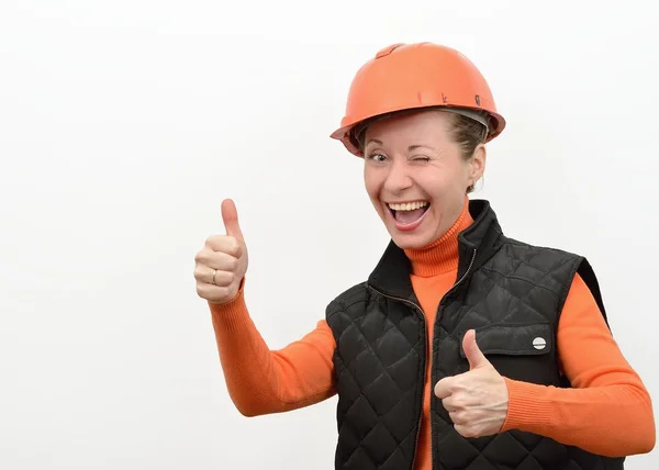Kvinna som arbetar Byggbranschens jublar en skyddande hjälm och glada lycka. — Stockfoto