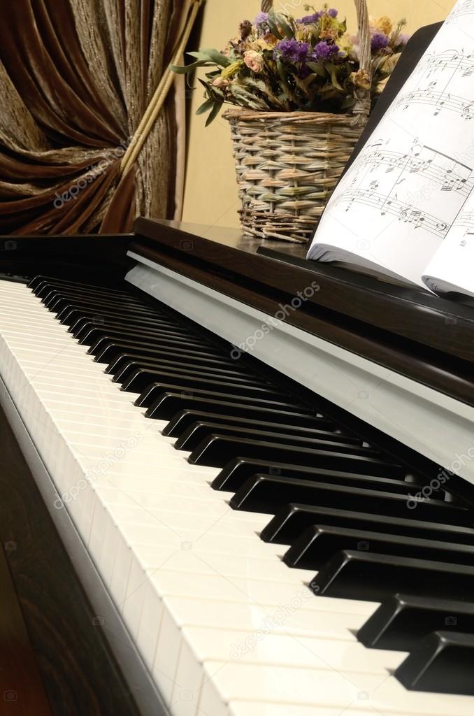 Keys home musical instrument upright piano disclosed notes and basket with flowers