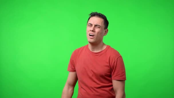 Very exhausted man. Chroma green background. — Stock Video