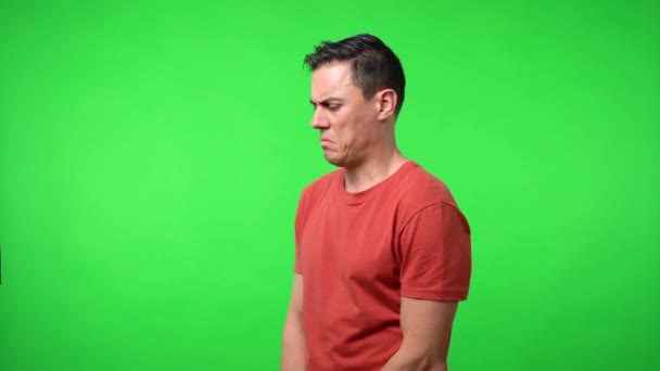 Man looking suspiciously. Chroma green background. — Stock Video
