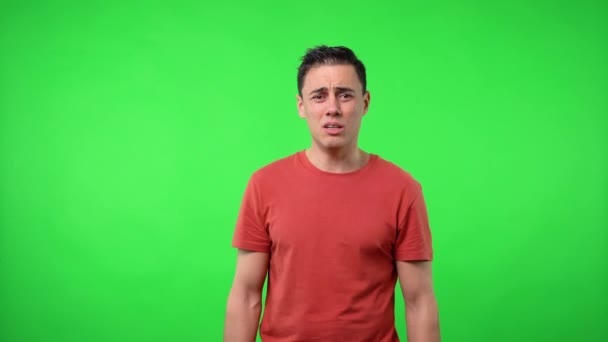 Dejected man after crying. Chroma green background. — Stock Video