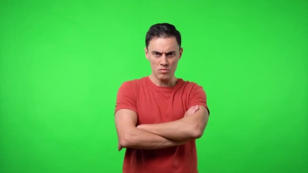 Man looking seriously at camera. Chroma green background. — Stock Video