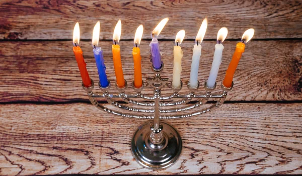 Jewish holiday Hanukkah background with menorah over chalkboard — Stock Photo, Image