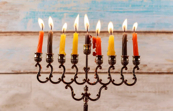 Jewish holiday Hanukkah creative background with menorah.