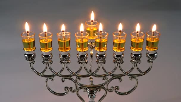 Hebrew Menorah of Hanukkah with burning candles is traditional symbol for holiday Jewish — Stock Video