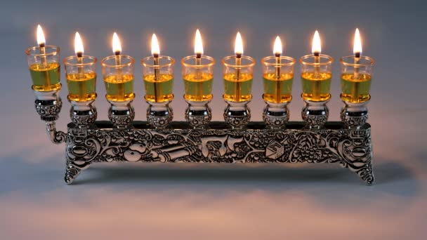 Lighting oil candles in menorah for Hanukkah — Stock Video