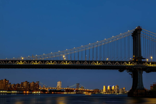 Aerial view style New York City beautiful with Manhattan bridge as seen from Manhattan skyline at night