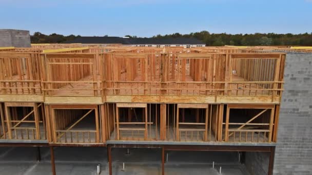Apartment complex building under construction material in wooden frame — Stock Video