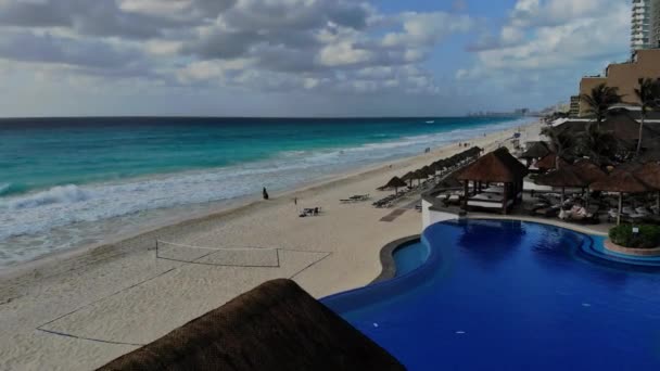 Cancun, Mexico vacation on aerial view with hotel swimming pool with beach umbrellas beds — Stock Video