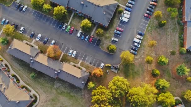 Aerial drone view on autumn trees time in homes small town rooftops neighborhood — Stock Video