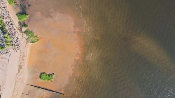 Yellow sandy beach with waves on blue sea view shot from a height — Stock Video