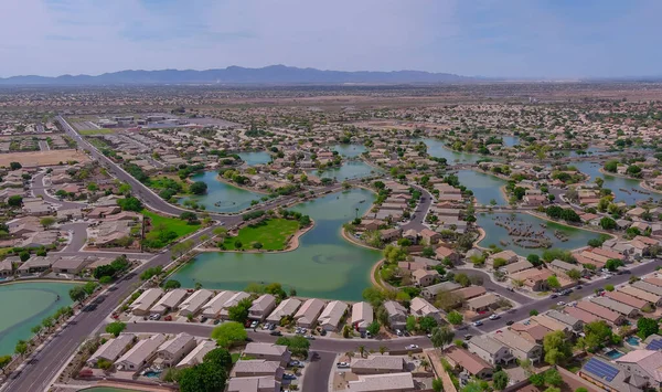 Aerial overlooking small desert small town a Avondale city of rugged mountains near of state capital Phoenix Arizona