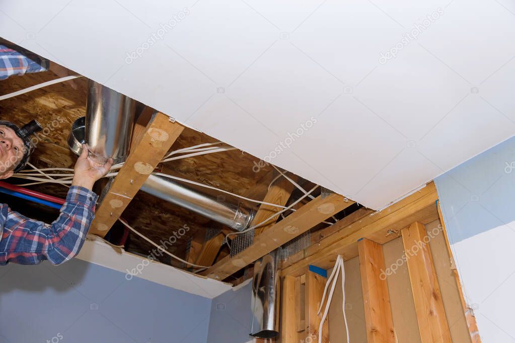 Remodelling home the installation system HVAC duct ventilation pipes in central conditioning a ceiling