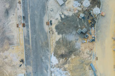 Aerial panorama view of building site for future house, stacks of brick for construction