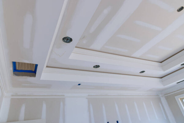 Finishing plastering drywall putty in the room walls on empty room renovation house remodeling new house under construction
