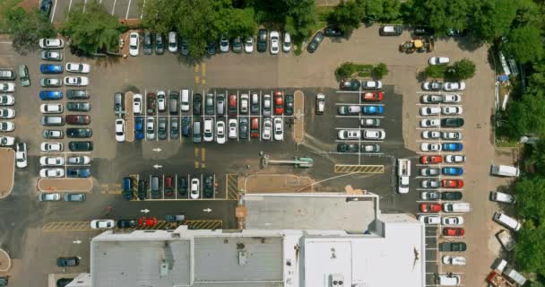 Huge parking for cars near the shopping center from the air on the parking lot there are cars — Stock Video