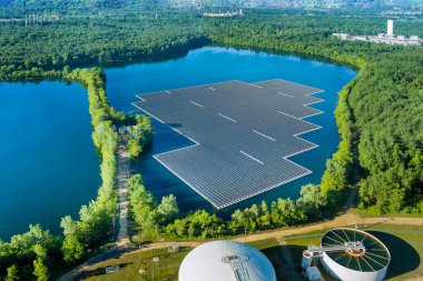 Aerial view of floating solar panels cell platform on the beautiful lake clipart