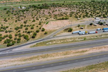 Aerial view of highway rest area with large car park for cars trucks top view of highway in desert New MEXICO USA clipart