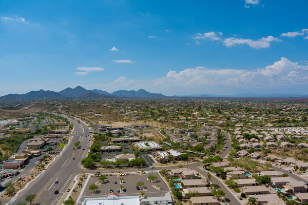 Aerial view of residential district at suburban development with a american Fountain Hills town near mountain desert in Arizona US