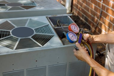 Air conditioning technician servicing of preparing to air conditioner clipart
