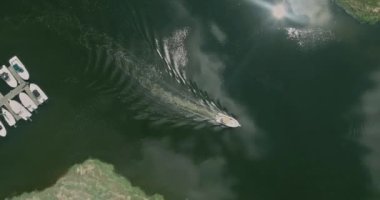 Aerial high altitude view of floating ship boat at blue ocean
