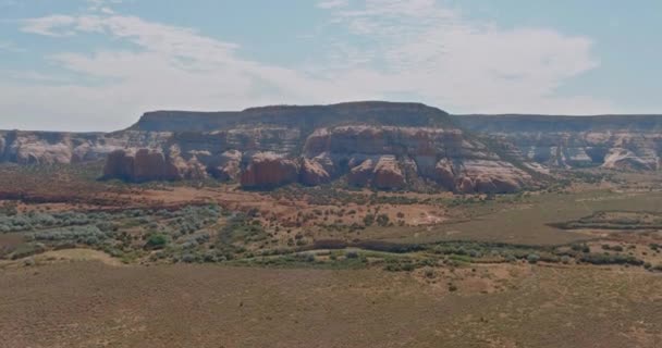 Zion National Park Utah Sunny a red rock mesa reveing a mountain in the distance. — Stock video