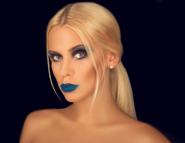 portrait of a beautiful blonde with creative make-up on