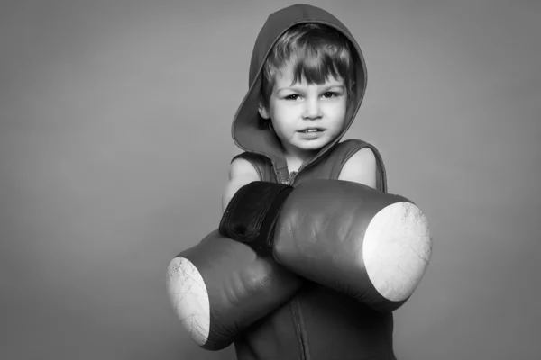 Black-and-white photograph of a boy with gloves and helmet — Stock Photo, Image