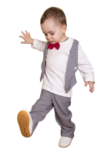 Niño pequeño con un traje a cuadros y pajarita —  Fotos de Stock