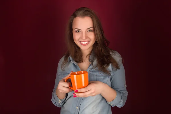 Beautiful smiling girl with a cup — Stock Photo, Image