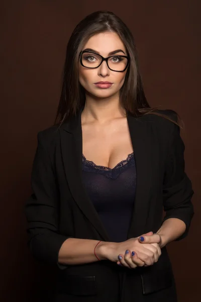 Business woman in glasses and a black suit — Stock Photo, Image