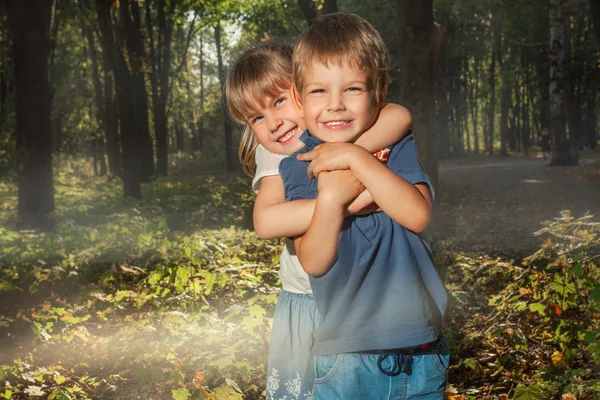 Little boy and girl hugging — Stock Photo, Image