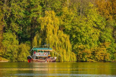 Uman, Ukraine 07.11.2020. Upper Pond and Anti Circe Island in the Sofievsky arboretum or Sofiyivsky Park in Uman, Ukraine, on a sunny autumn day clipart
