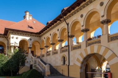 Alba Iulia, Romania - october 19.2025. the interior courtyard with arched galleries, manicured greenery, and traditional architecture at the Coronation Cathedral