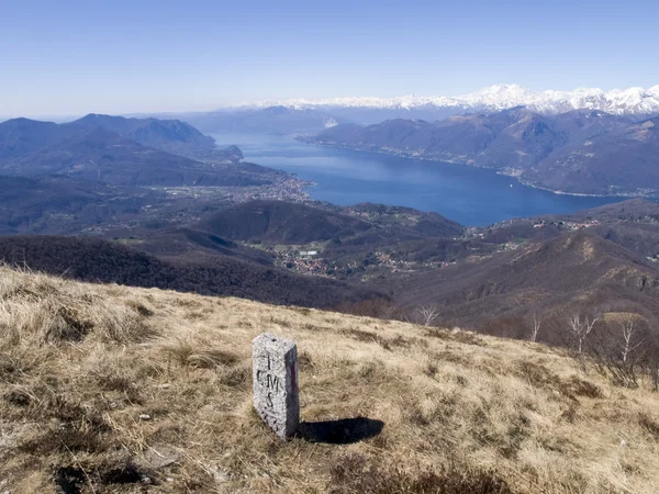 Boundary stone between Switzerland and Italy — Stock Photo, Image