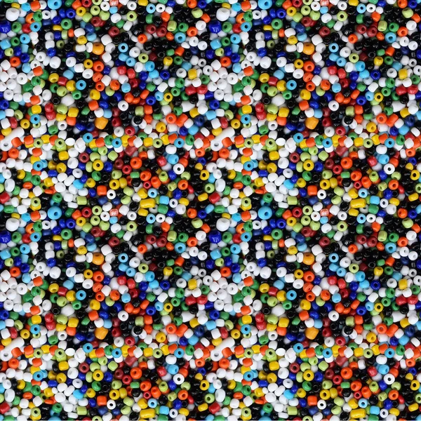 Seamless pattern with beads. Multi Colored beads pattern. Close Up photo of bright colored beads.