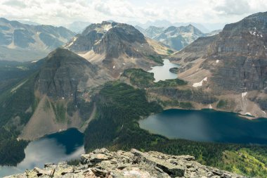 Mountainous terrain with lakes from above, panoramic landscape view