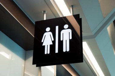 Siyah ve beyaz renk düzeninde cinsiyet sembolleri olan tuvalet işareti. Toronto, ON