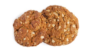 Beyaz arka planda üzümlü ve hindistan cevizli yulaflı kurabiyeler. Yukarıdan bak. Yüksek kalite fotoğraf