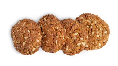 Beyaz arka planda üzümlü ve hindistan cevizli yulaflı kurabiyeler. Yukarıdan bak. Yüksek kalite fotoğraf