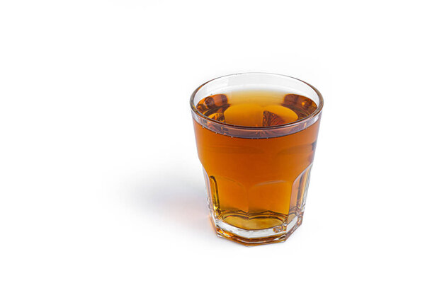 Apple juice in glass on a white background. 