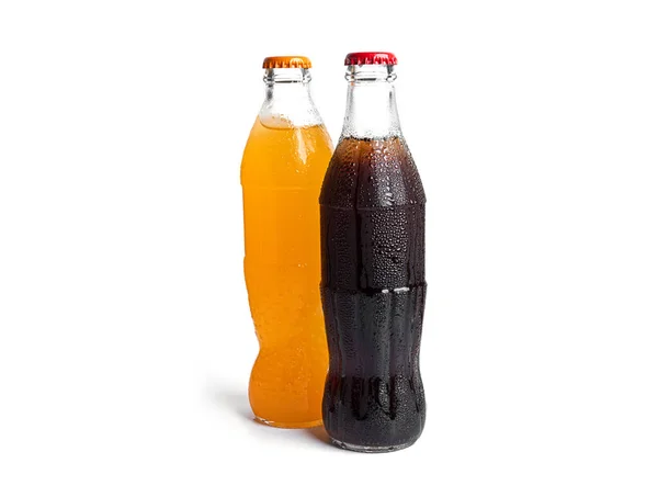 Bottles of soda isolated on a white background. Three multicolored soda bottles. — стоковое фото