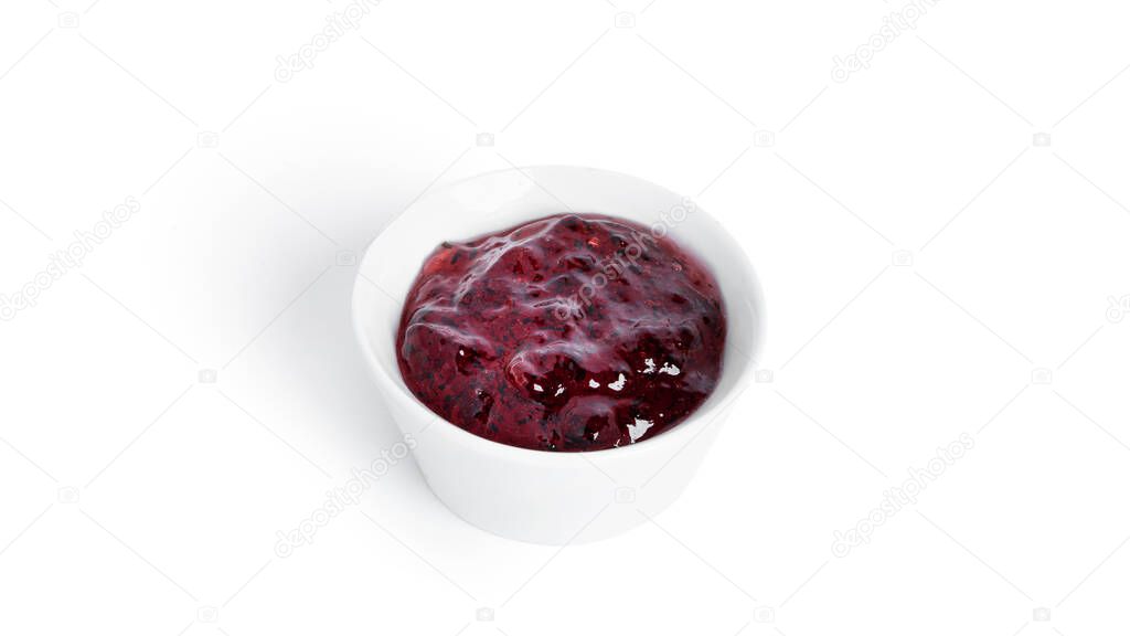Jam in a gravy boat isolated on a white background. Purple jam.